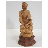 Vintage carved wood man eating statue