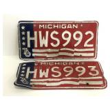 Two vintage 1976 Michigan license plates