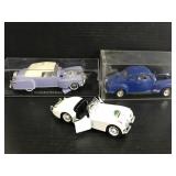 Three vintage luxury car models