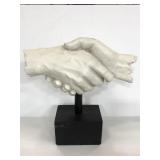 Vitruvian shaking hands sculpture