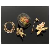 Gold toned brooches, pin, pendant, and other