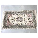 Hand woven silk pastel area rug with fringe