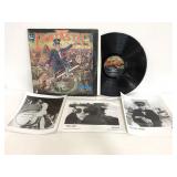 Elton John record and three photographs