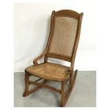 Antique wood rocking chair with cane back & seat