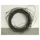 Spool of barbed wire fencing