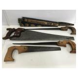 Four vintage wood handled saws & blade set