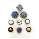 Nine silver and gold toned pretty button covers