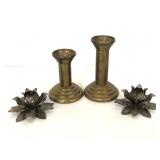 Four brushed metal candlestick holders