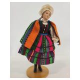 Vintage doll on wood stand