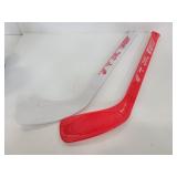 Two Detroit Red Wings mini plastic hockey sticks