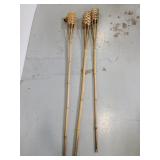 Three bamboo tiki torches