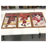 Three wood framed Red Wings hockey posters