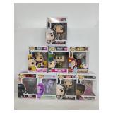 Eight Pop Funko figures in boxes