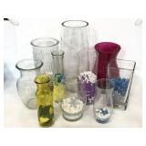 Ten assorted glass vases with vase filler beads