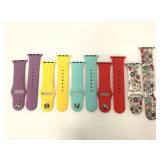 Five assorted silicon Apple Watch bands