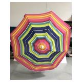 Large colorful striped outdoor umbrella