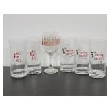 Five tall Christmas glasses and one wine glass