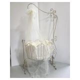 Wrought iron Victorian-style ornate cradle