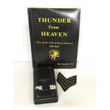 Vintage military book, medal holder, and patch
