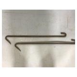 Pair of old rusted iron hooks