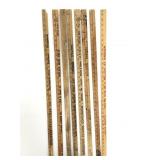 Eight advertising yard sticks