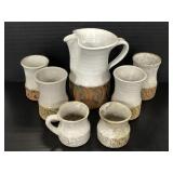Signed pottery made pitcher and assorted glasses