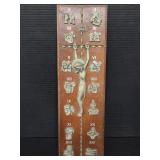 Metal on wood crucifix plaque