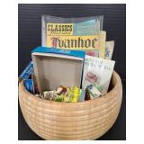 Wood bowl of vintage books, blocks and more