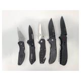 Five assorted black pocket knives