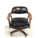 Vintage wood and leather rolling bankers chair