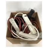 Assorted extension cords, power strips, and more