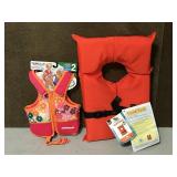 2 life vests, 1 adult & 1 child as new with tags