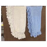 Two knit-like blankets with ruffles