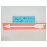 Pink and blue decorative wood signs