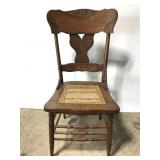 Cane sat chair w/ carved back