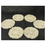 Six vintage round doilies