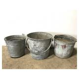 Three metal buckets