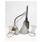 Galvanized metal funnels, rusty springs, shovel