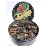 Tin of old vintage caster wheels