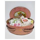 Vintage tin full of sewing notions