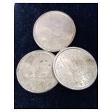Three US Sacagawea dollar coins
