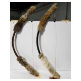 Two decorative fur covered bows