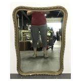Vintage wall mirror with braided design
