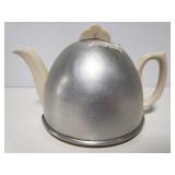 Vintage teapot with metal cover