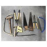 Assorted tools- saws, sledgehammer, trimmers