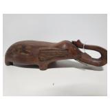 Carved wood elephant with  nail tusks