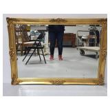 Large gold toned ornate framed mirror