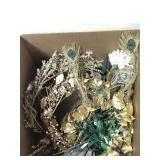 Assorted gold wreaths and faux flowers