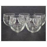 Five tiny fish bowl glasses