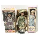 Trio of collectible porcelain dolls